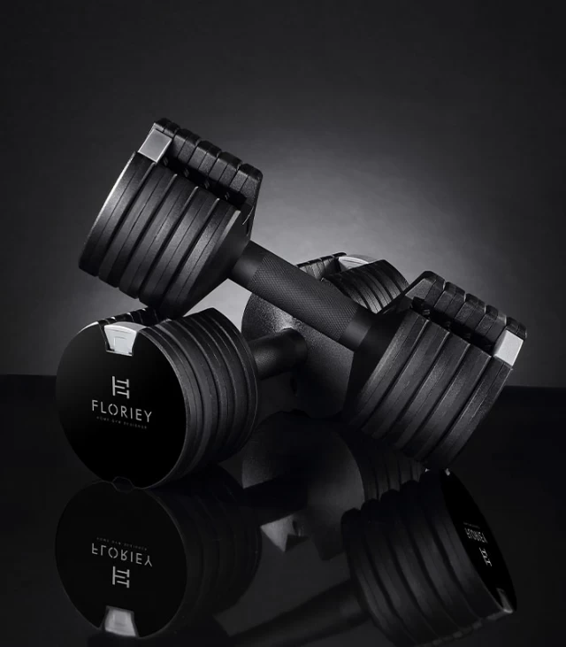 12.5lb adjustable dumbbell with reflective surface, showcasing multi-weight options