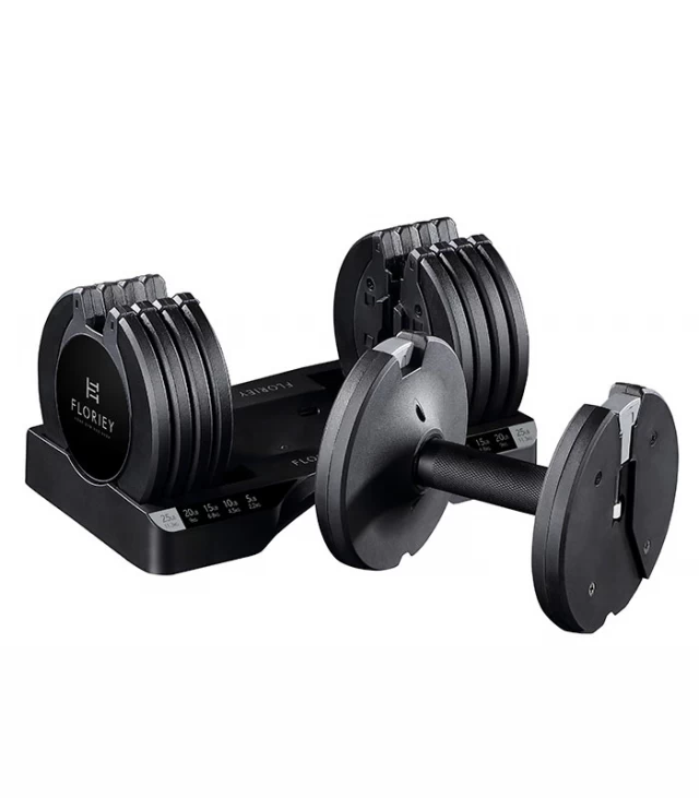 25lb black adjustable dumbbells resting in their storage cradle