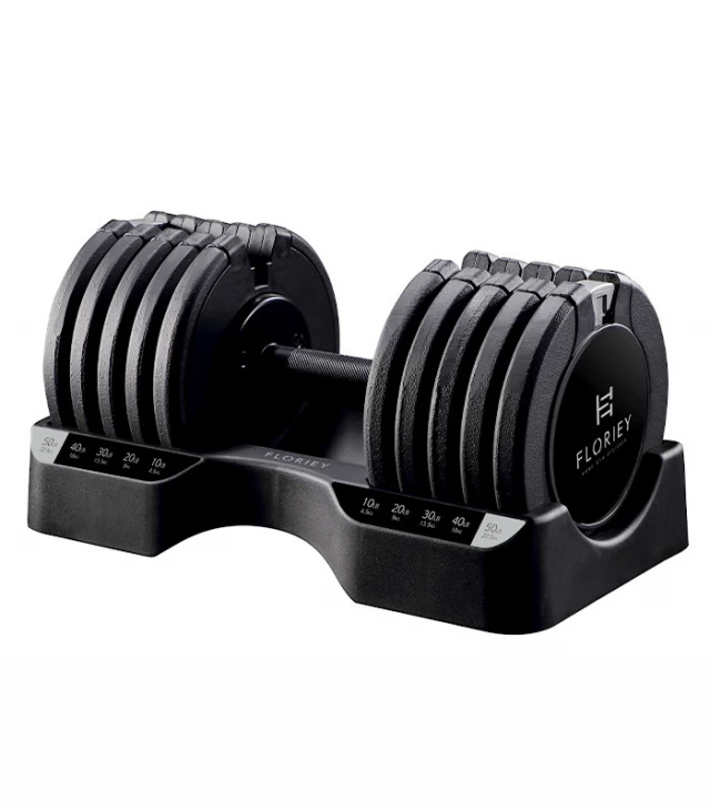 Side view of 50lb black adjustable dumbbells from T9 series in their storage rack