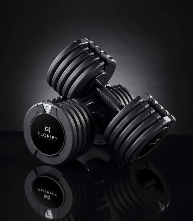 50lb black adjustable dumbbell set from T9 series on a reflective surface, ideal for strength training