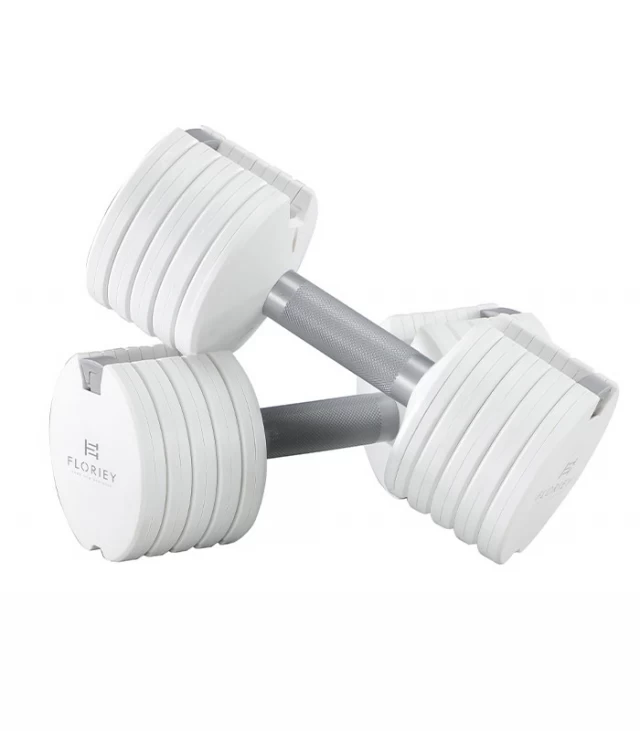 Close-up of white 12.5lb adjustable dumbbell with weight adjustment feature