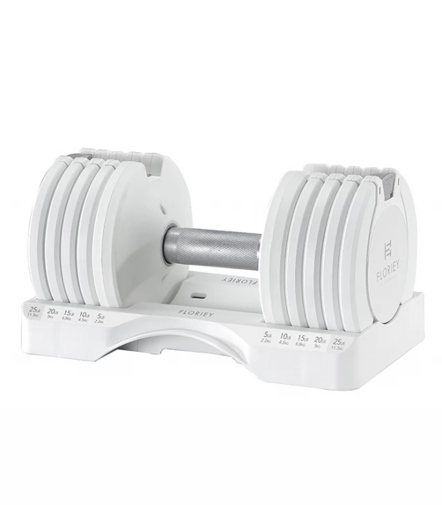 Close-up of 25lb white adjustable dumbbell set from T9 series in its storage cradle