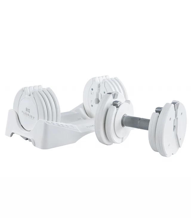 27.5lb white adjustable dumbbell from T9 series resting in its storage cradle