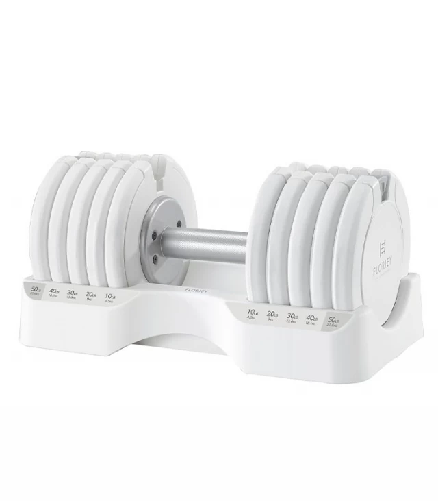 T9 Series 50 lb white dumbbells with stand, angled view